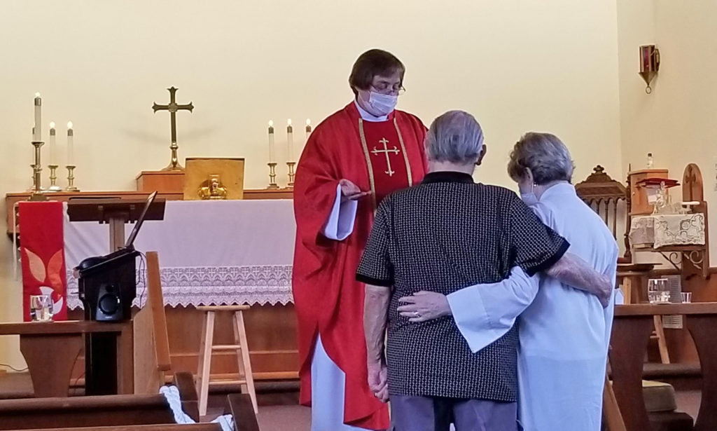 Couple receiving anniversary blessing