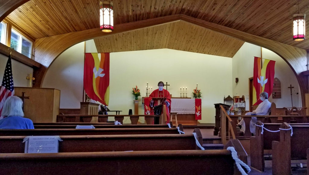 Anne+ preaching, wearing mask